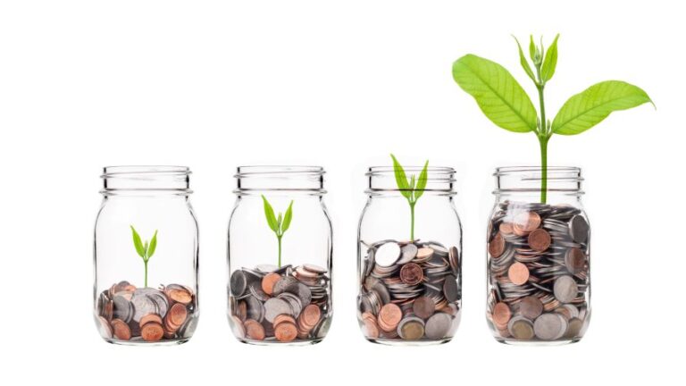 Mix coins with seed in clear bottle on white background Business investment growth concept saving concept